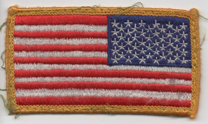 Embroidered reverse American flag patch with gold border, ideal for GORUCK rucking gear.