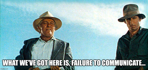 Two men in hats under blue sky, with caption 'What we've got here is, failure to communicate...'