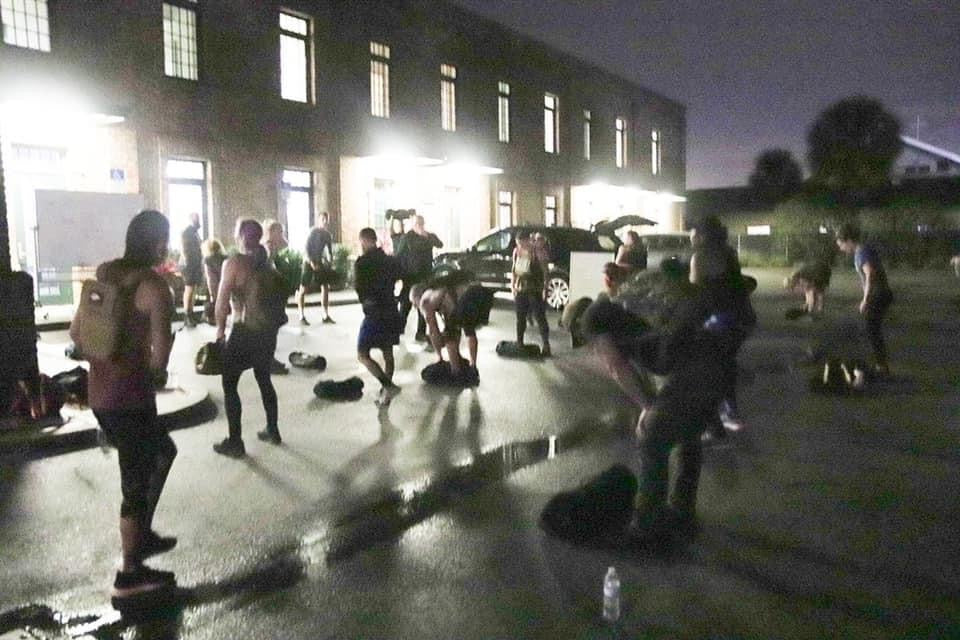 GORUCK group training event outdoors at night with participants using rucking gear