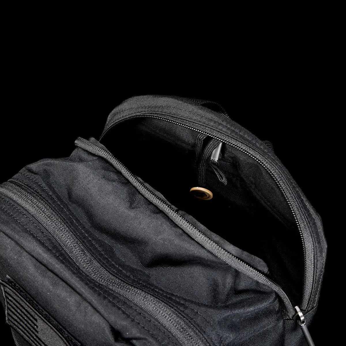 GORUCK black rucksack open to show two compartments and internal organization