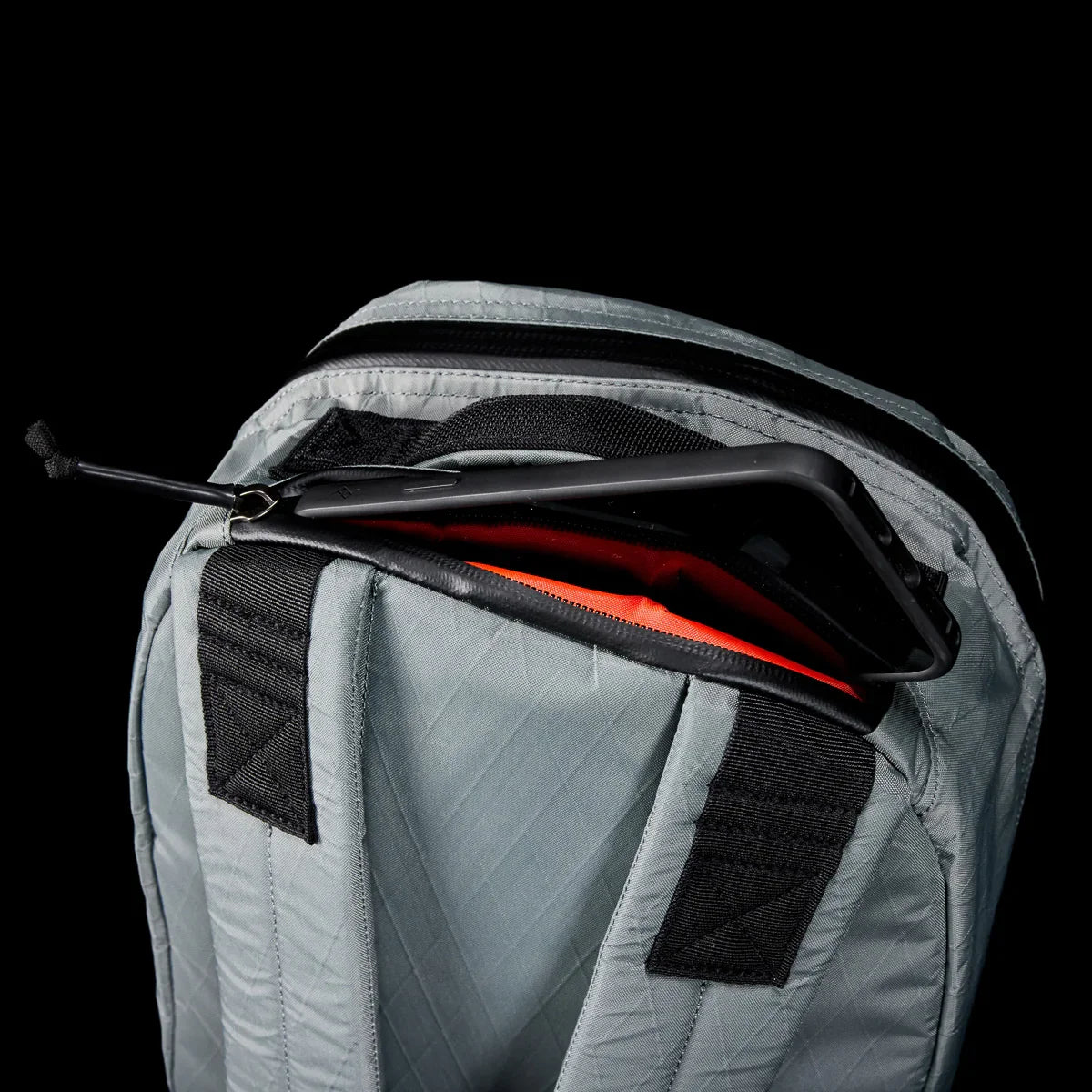 GORUCK Bullet 15 gray X-Pac rucksack backpack with phone in top pocket, black background