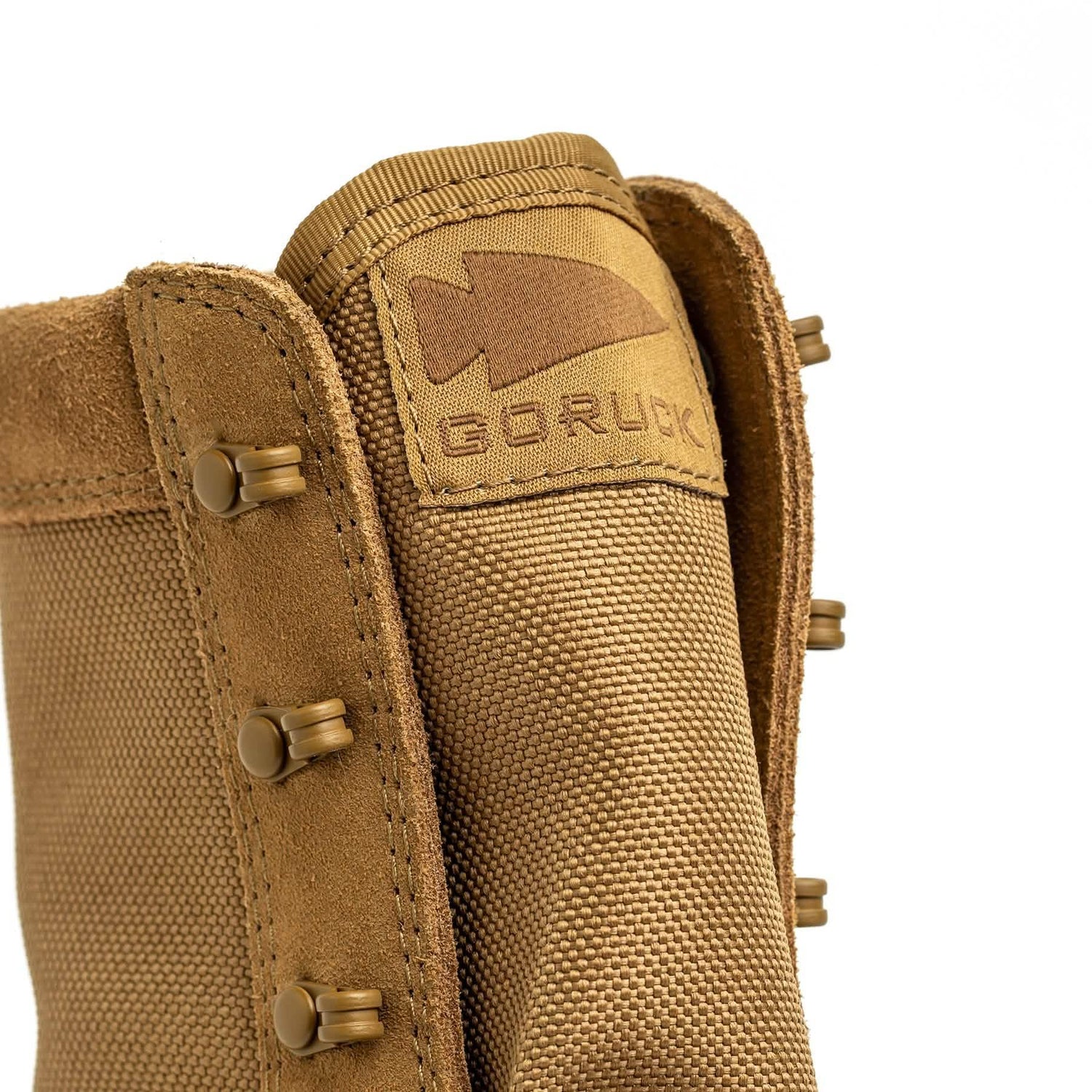 GORUCK rucking boot tongue close-up, durable brown fabric with logo and rugged eyelets