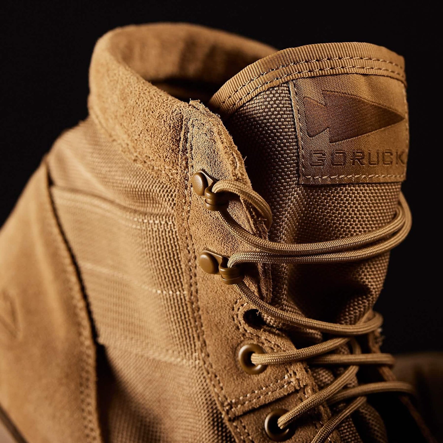 Close-up of tan GORUCK rucking boot with durable laces and rugged material