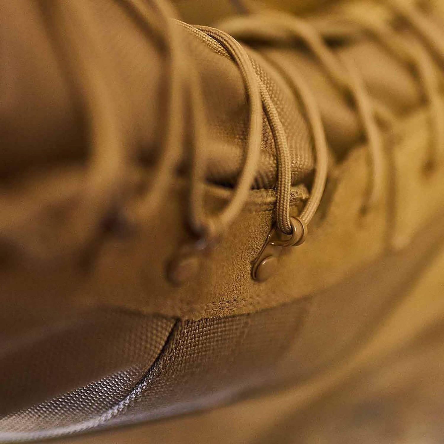Close-up of tan GORUCK rucking boot laces and durable material