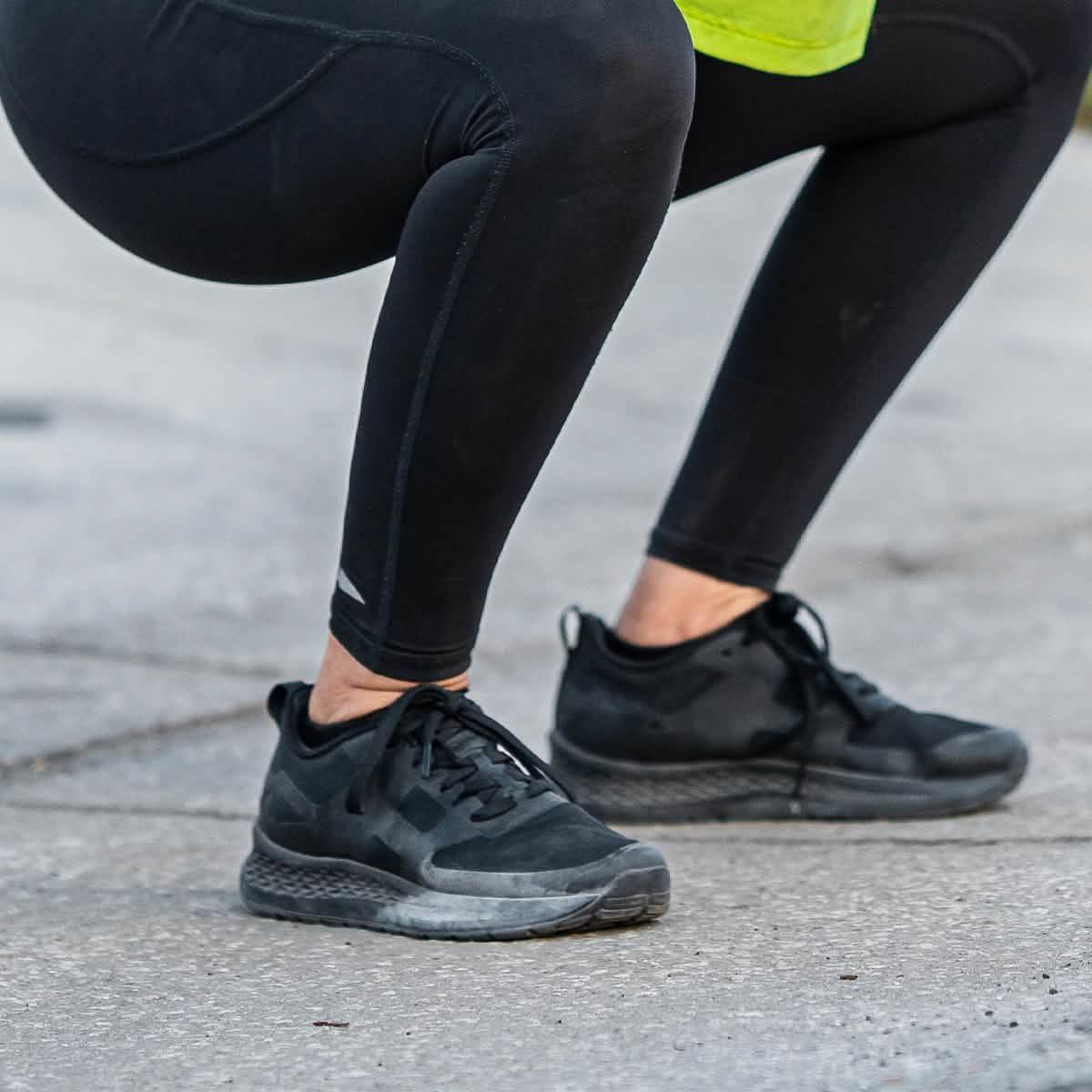 GORUCK rucking shoes in black worn outdoors during a squat exercise on pavement
