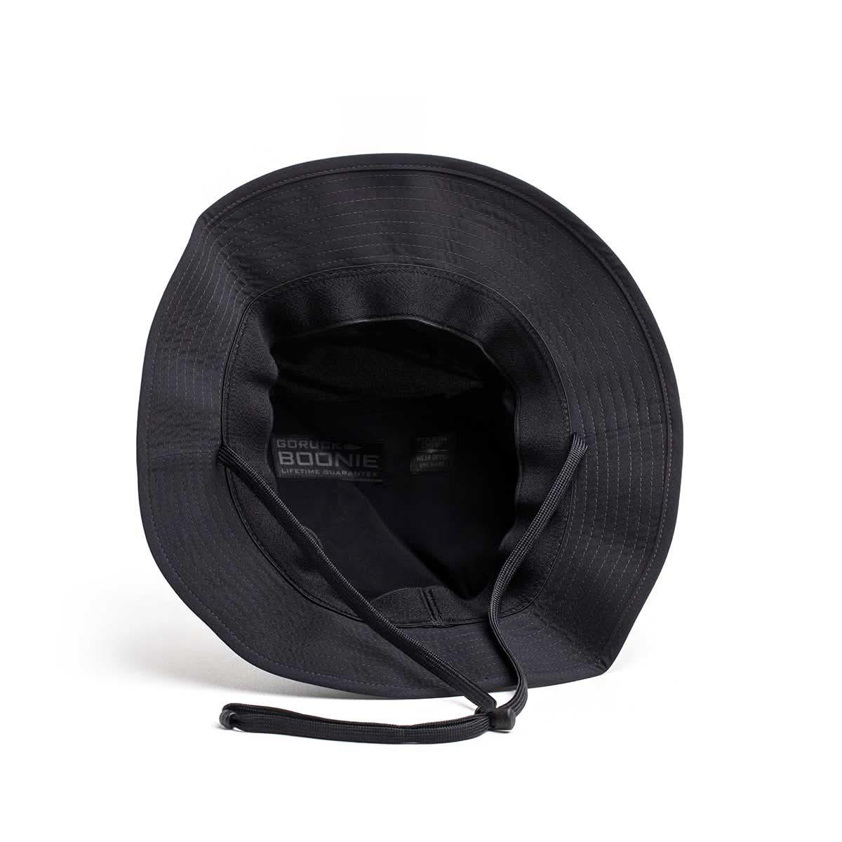 GORUCK black Boonie hat with chin strap, rugged rucking gear on white background