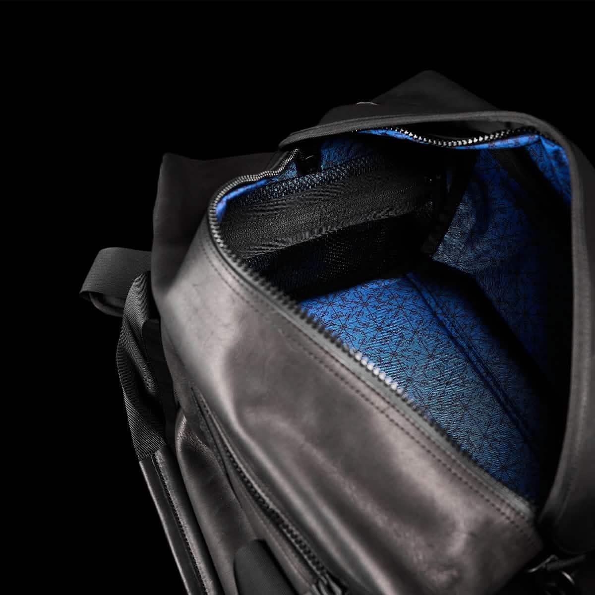 GORUCK black kit bag open to show blue patterned interior and zipper pocket