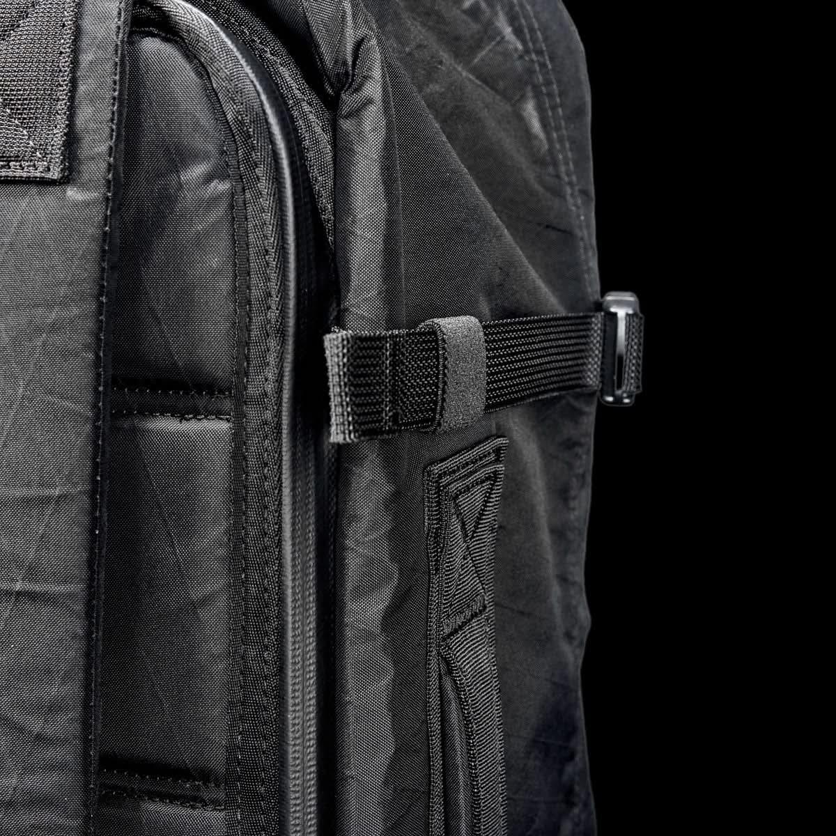 GORUCK black rucksack close-up, durable X-Pac material, compression strap detail