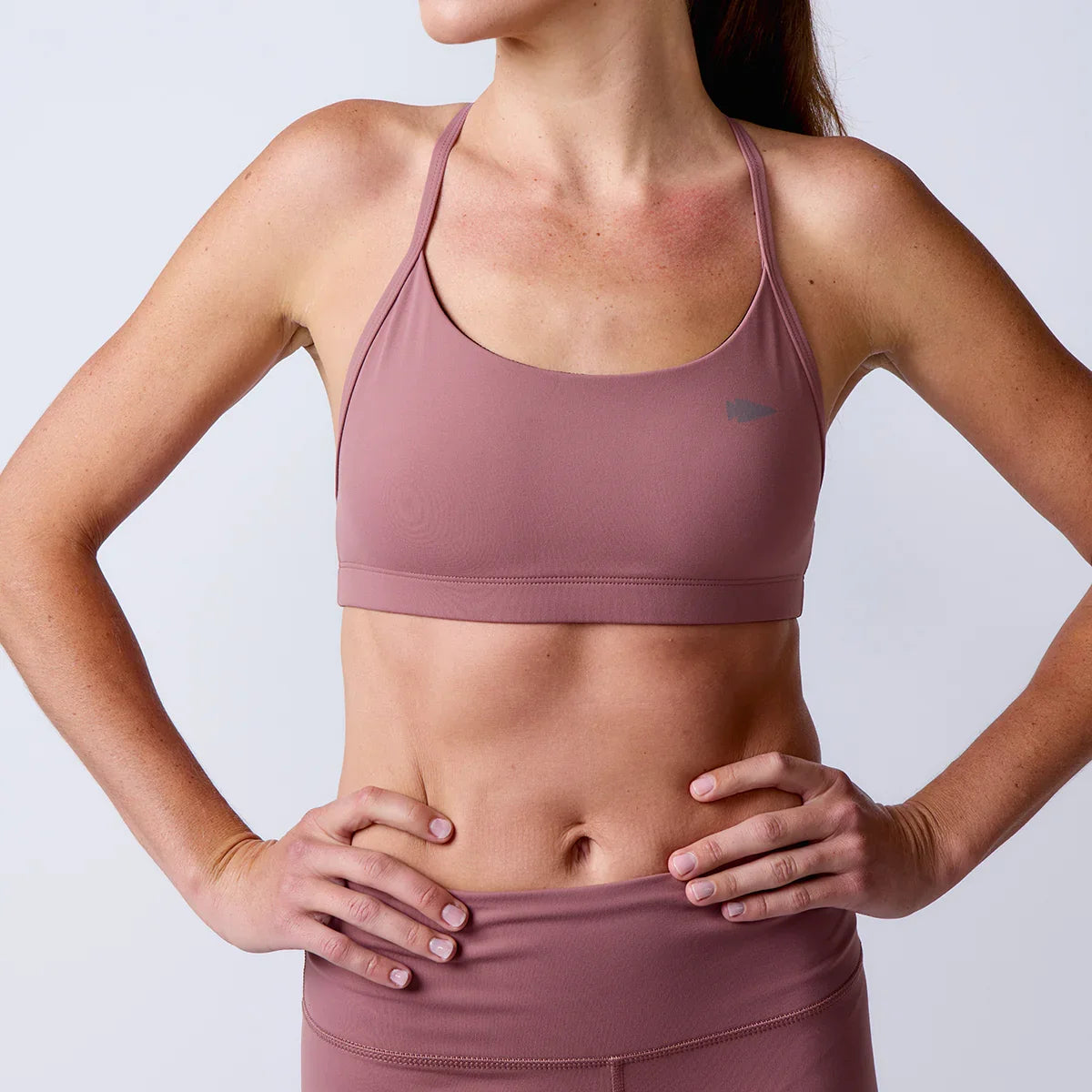 GORUCK women's mauve sports bra and high-waisted leggings for rucking fitness