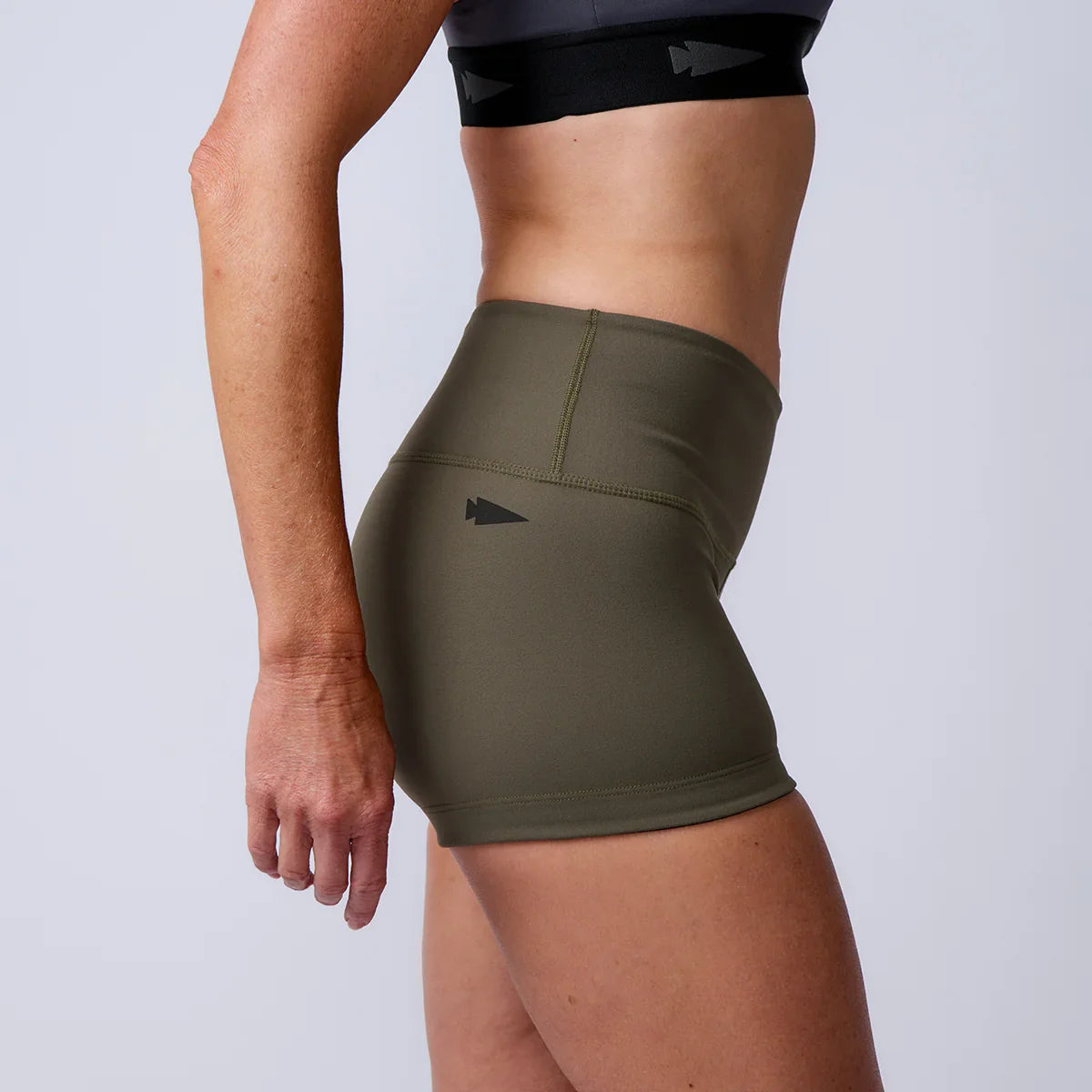 GORUCK women's olive green rucking shorts and black sports bra side view