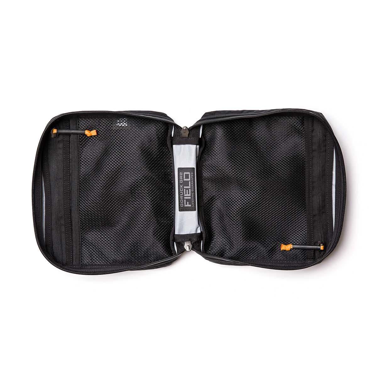 GORUCK black rucking field pouch opened flat, mesh compartments, durable zipper pulls