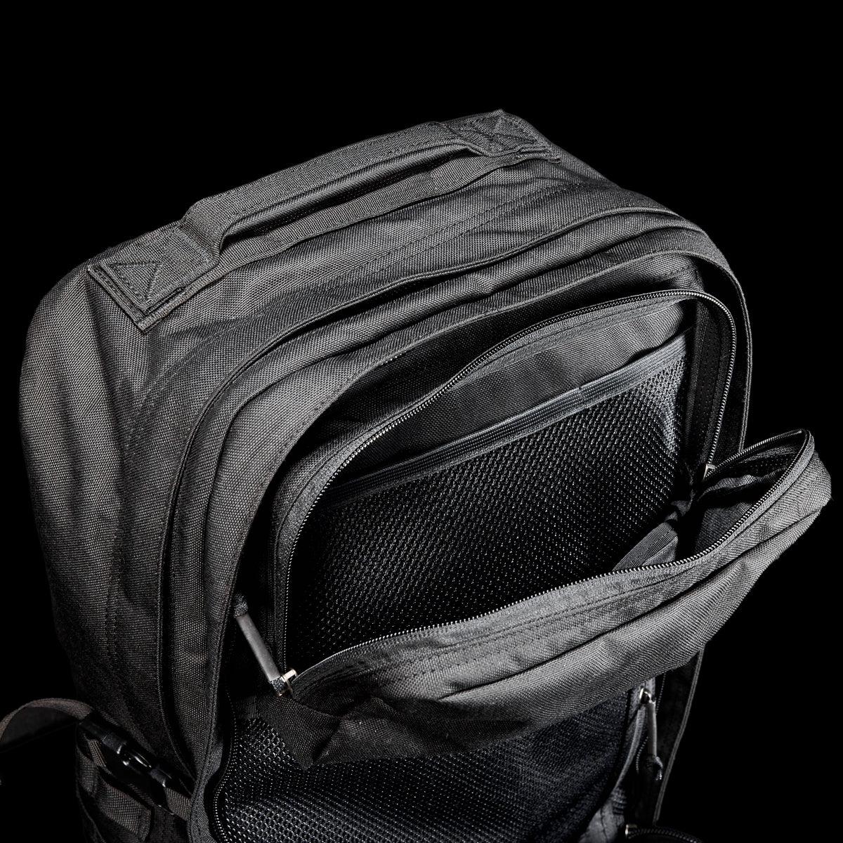 GORUCK black rucking backpack with open compartments showing durable construction