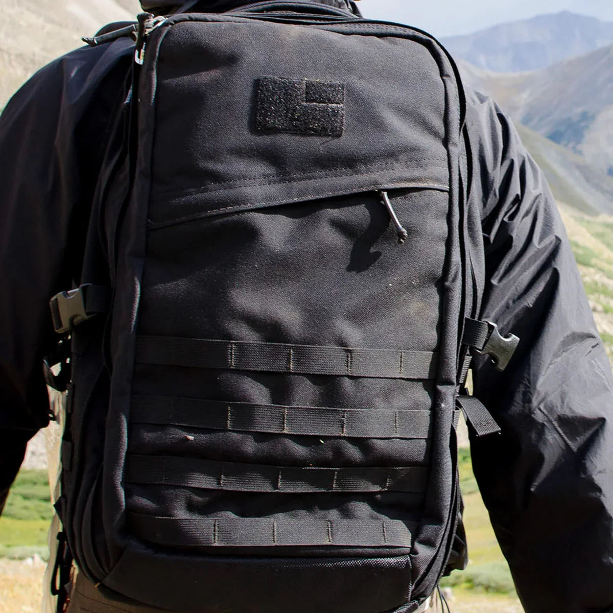 GORUCK black rucksack backpack worn outdoors, rugged gear for rucking and hiking