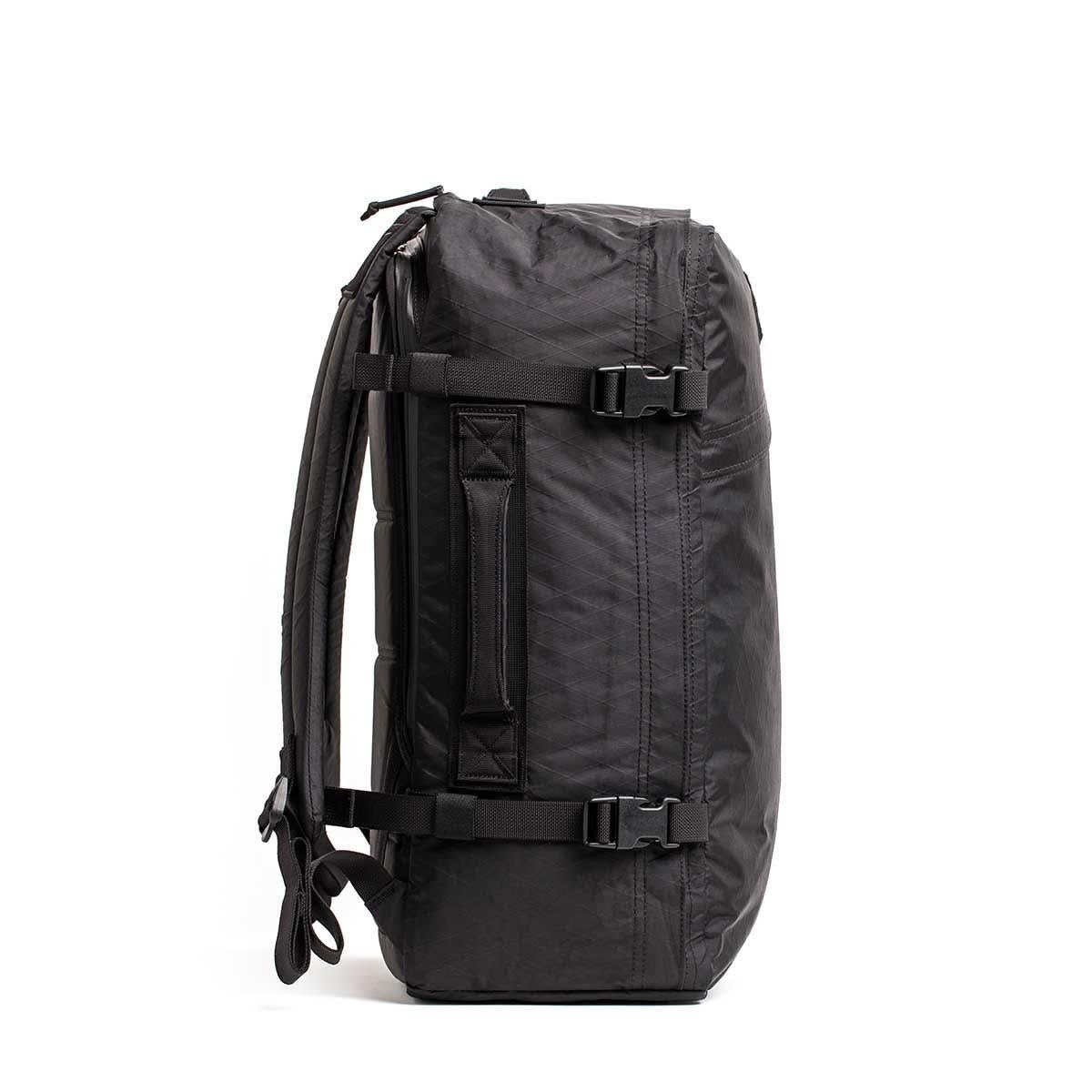 GORUCK black rucksack backpack with side handle and compression straps, side view