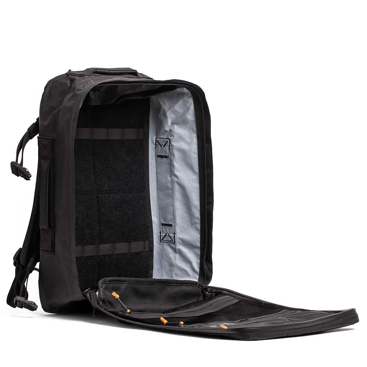 GORUCK black rucksack with open clamshell design and visible interior compartments
