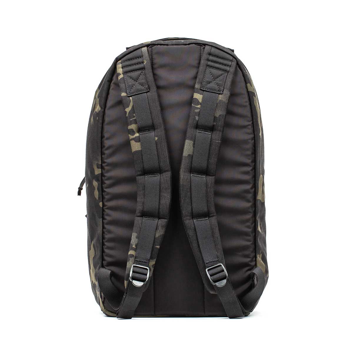 The Bullet Ruck Classic - Ballistic Nylon Cordura is shown from the back in black camouflage, featuring padded shoulder straps and metal loops.