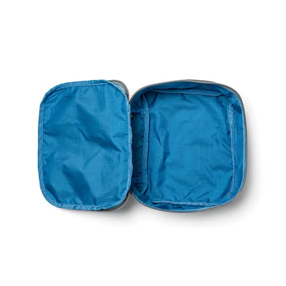 Unzip the blue Shadow Pockets - Ripstop ROBIC® by GORUCK, designed with lightweight ROBIC Ripstop Nylon and zippers for efficient rucksack organization, revealing an empty interior.