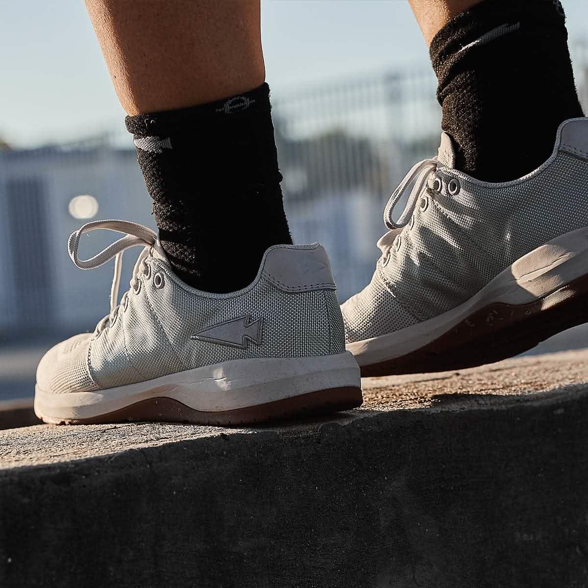 GORUCK rucking shoe in lunar rock color worn outdoors on concrete step