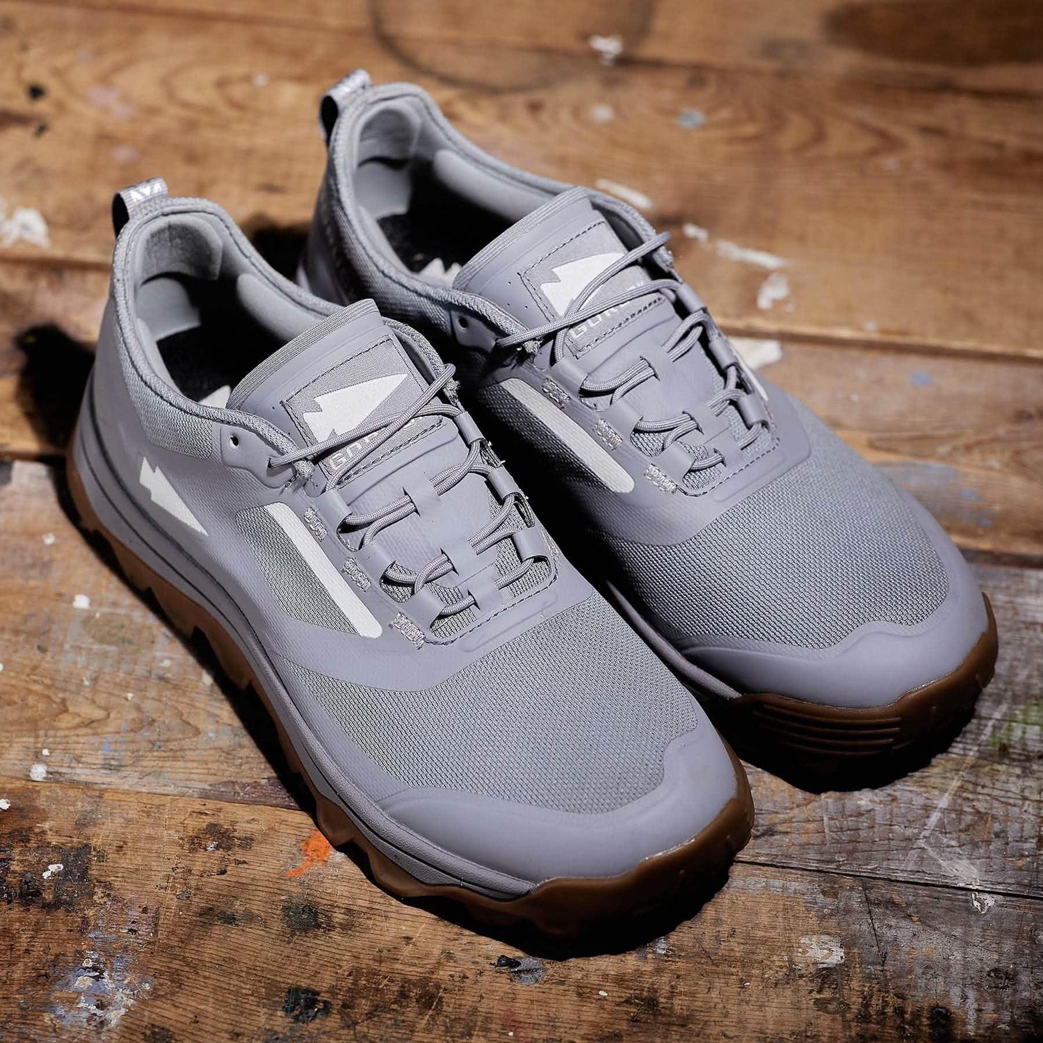 GORUCK grey rucking shoes with mesh upper on rustic wooden floor