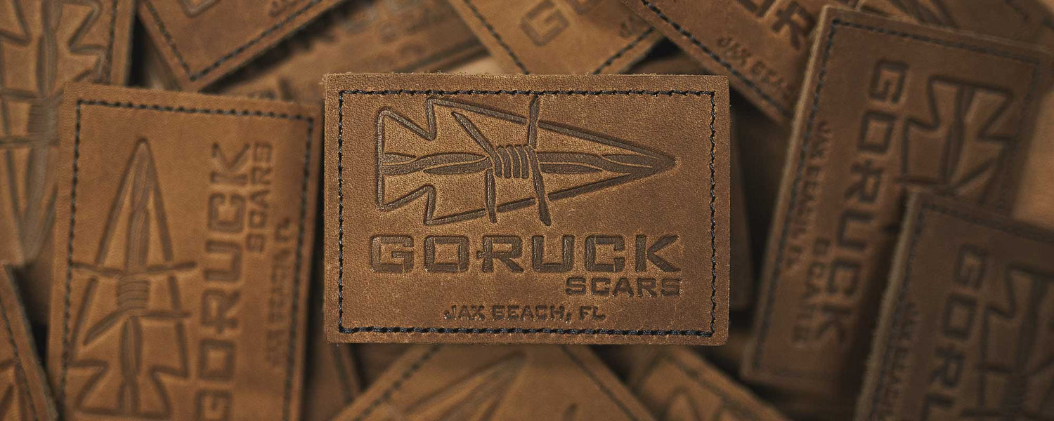 A leather patch with an arrowhead design and