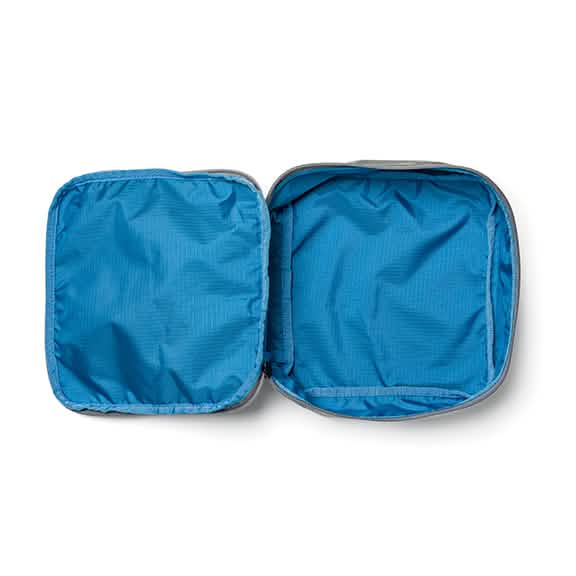 The open gray and blue Shadow Pocket by GORUCK, made from robust Ripstop ROBIC® Nylon, reveals its spacious interior, perfectly crafted to enhance the organization of your rucksack. Designed for seamless integration with other Shadow Pockets.
