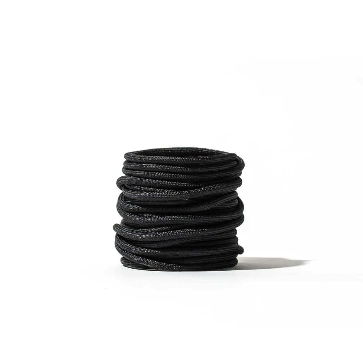 GORUCK black speed laces coiled on white background, rugged rucking shoe accessory