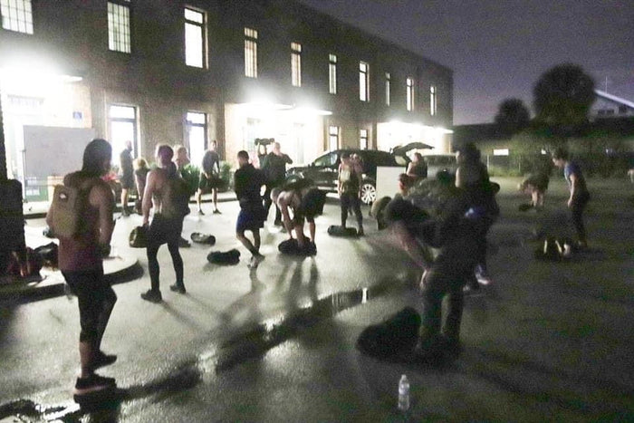 GORUCK group training event outdoors at night with participants using rucking gear