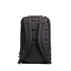 The GR1 USA - Waterproof X-PAC shown from the back, featuring padded shoulder straps and stitching details—a durable black backpack designed for everyday use.