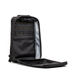 The GR1 USA - Waterproof X-PAC rucksack stands upright with its main compartment unzipped, revealing multiple interior pockets—an ultra-durable, waterproof backpack designed for everyday adventures.