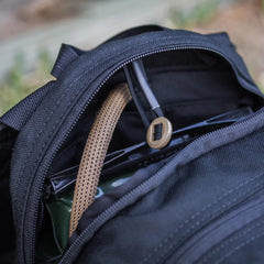 GORUCK rucksack with hydration bladder and hose, durable black rucking gear close-up