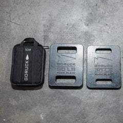 GORUCK 10lb ruck sandbag and 20lb, 30lb ruck plates on concrete floor