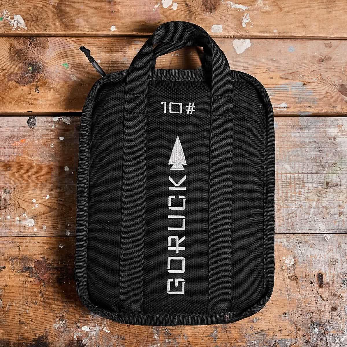 GORUCK 10lb ruck plate in black on wooden surface, durable rucking gear