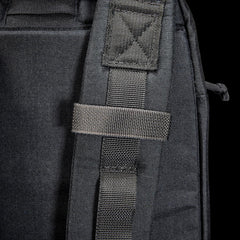 Close-up of GORUCK black rucksack shoulder strap with heavy-duty stitching and MOLLE webbing