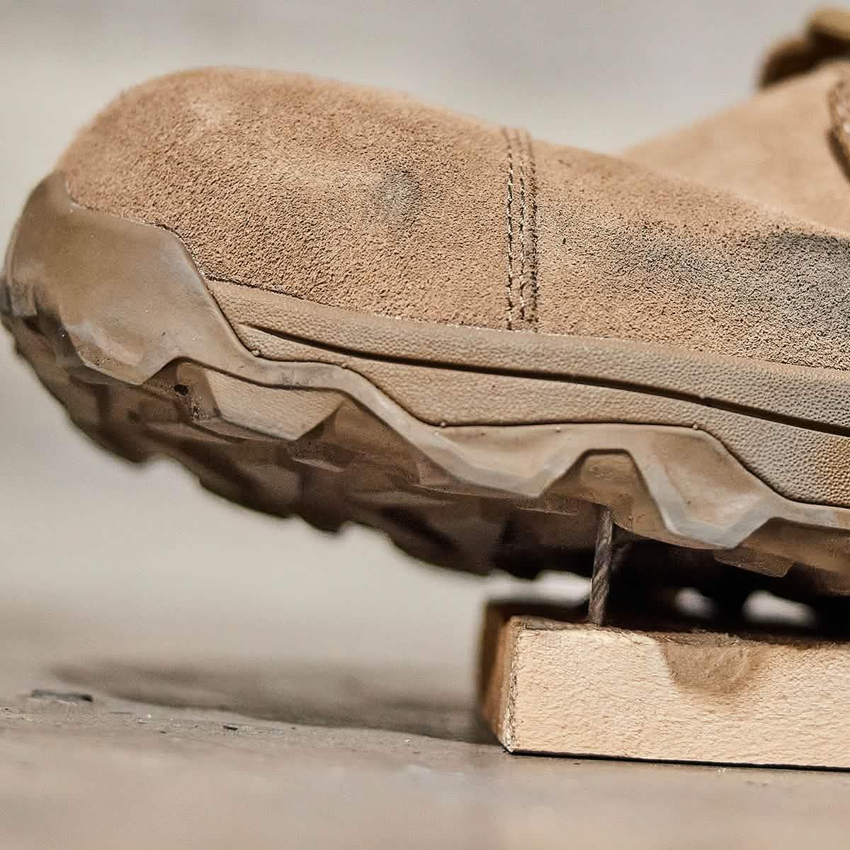Close-up of rugged tan GORUCK rucking shoe with durable tread and suede upper