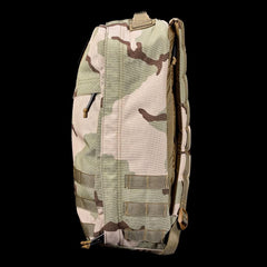 GORUCK camouflage rucksack side view, heavy-duty tactical backpack on black background