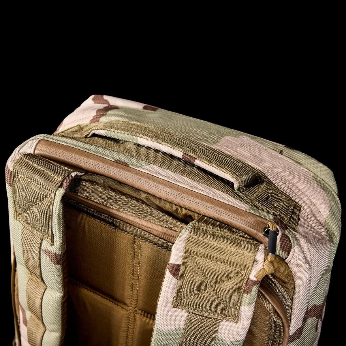 GORUCK camo rucksack top view with rugged handle and zippered main compartment