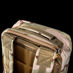 GORUCK camo rucksack top view with rugged handle and zippered main compartment