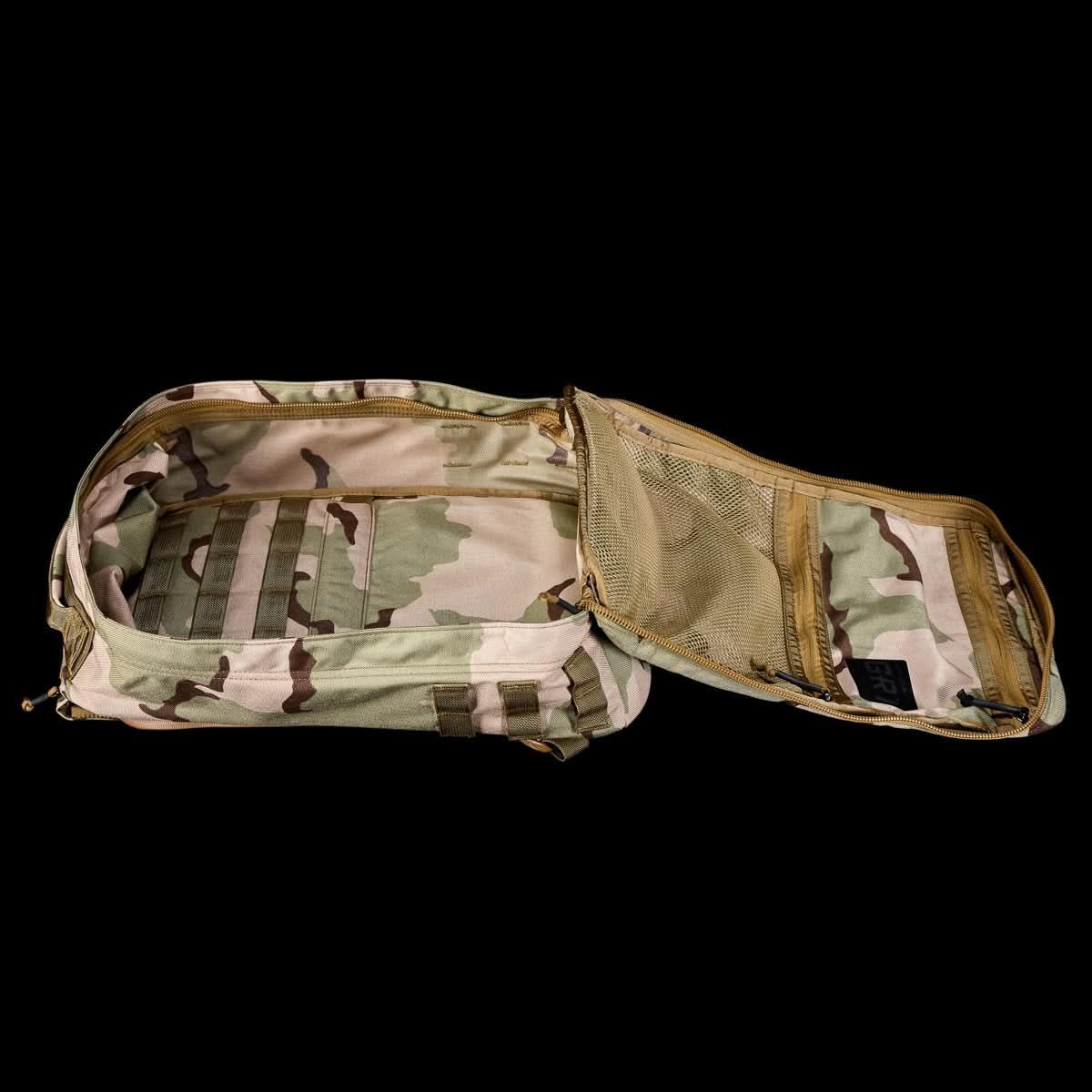 GORUCK camo rucksack open to show spacious main compartment and internal mesh pockets