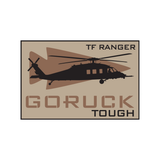 Black helicopter silhouette with "TF RANGER" and "GORUCK TOUGH" text on a tan background, the Day of the Ranger - Double Tough patch honors Task Force Ranger and their bravery during the Battle of Mogadishu—perfect for any GORUCK event.