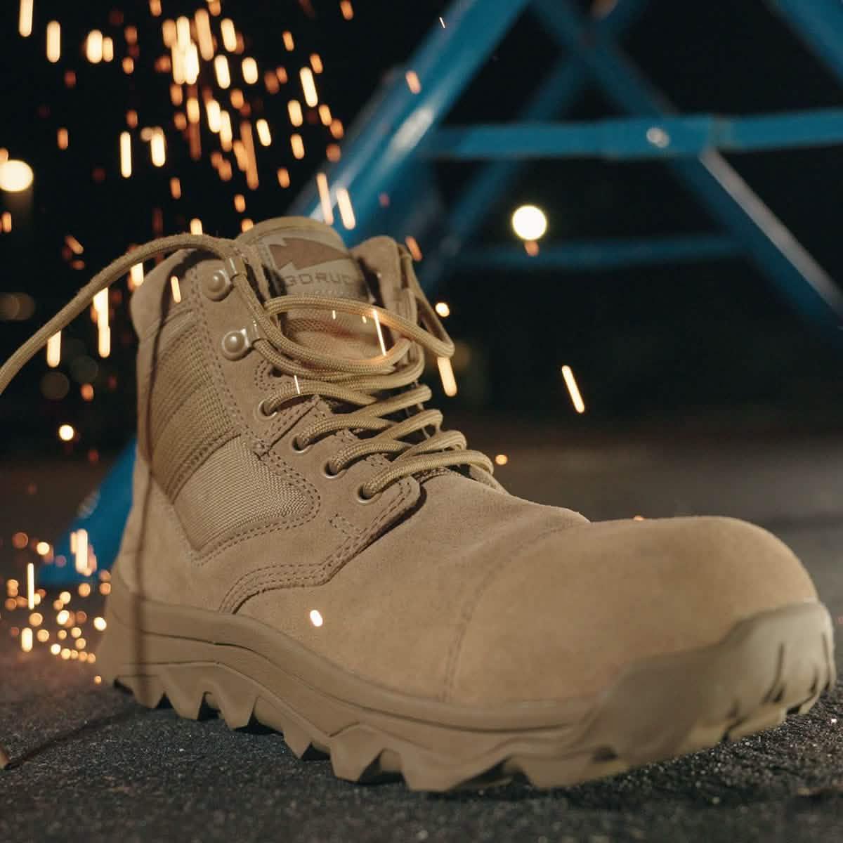 GORUCK tan rucking boot with sparks flying, showcasing durable outdoor footwear