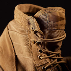 Close-up of tan GORUCK rucking boot with durable laces and rugged material