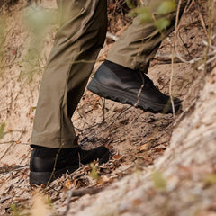 GORUCK rucking boots on person hiking up a dirt trail, outdoor gear close-up