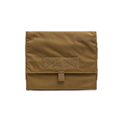 The Ammo Book is a tan, rectangular pouch made of durable ripstop nylon with a flap closure and a small Velcro patch on the front.