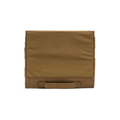 The Ammo Book is a square, brown case made of durable ripstop nylon with a bottom handle, displayed against a white background.