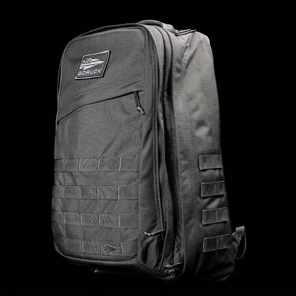 GORUCK Armor Grey tactical rucksack with patch, MOLLE webbing, rugged design on black background