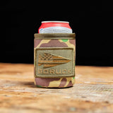 GORUCK camouflage can koozie with logo patch on wooden surface