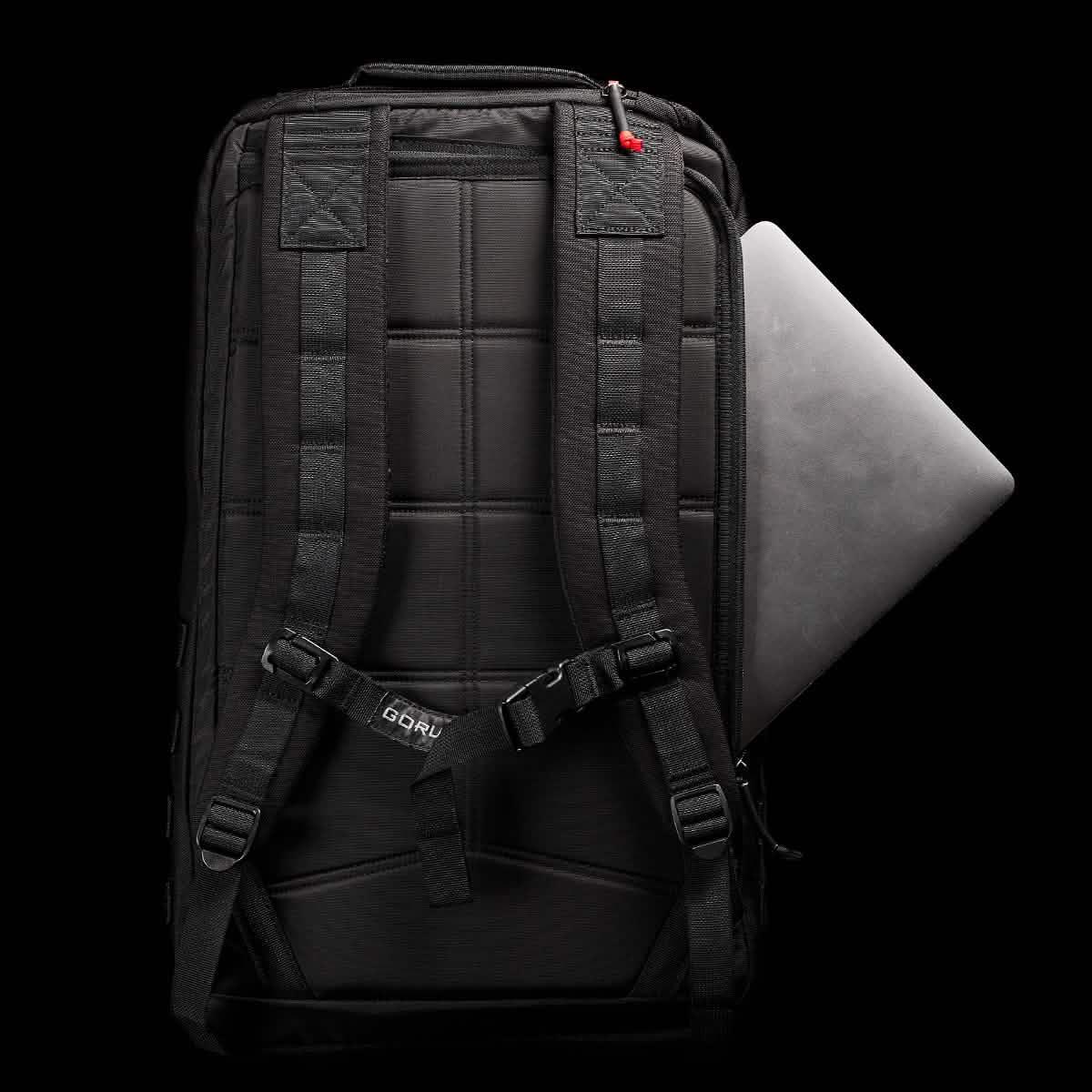 GORUCK black backpack with padded straps, laptop compartment, and rugged design on black background