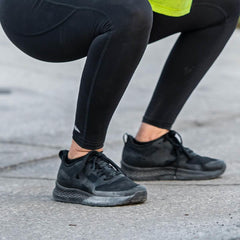 GORUCK rucking shoes in black worn outdoors during a squat exercise on pavement