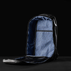 GORUCK Bullet 15L black leather rucksack open, showing blue patterned interior and mesh pocket