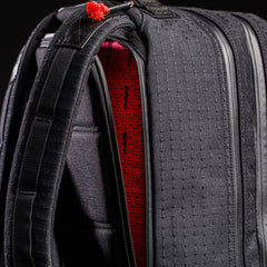 Close-up of the limited-edition Bullet Ruck x Carryology - GRXC2 Samurai 2.0 backpack, featuring a red patterned interior inspired by JPXDP 17oz Black Samurai Sashiko and padded straps for comfort.